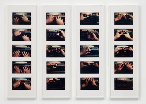Installation photograph. Twenty photographs show a woman’s hands working the keyboard and mechanics of a typewriter, except the last image, which shows the typewriter in shadow. The photographs are framed in columns of five.